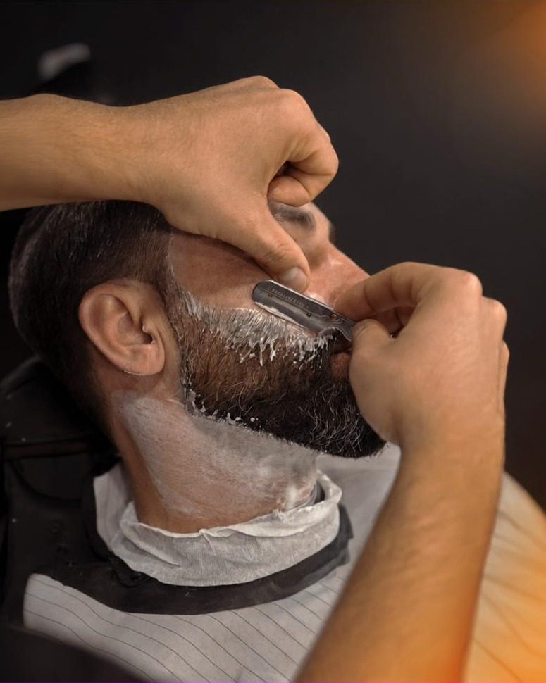 Straight razor shave in progress